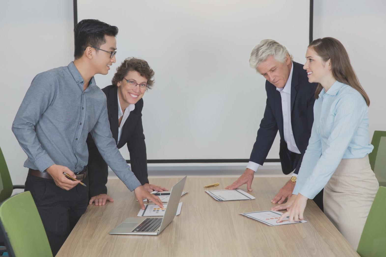 Business professionals reviewing financial reports and liquidity metrics